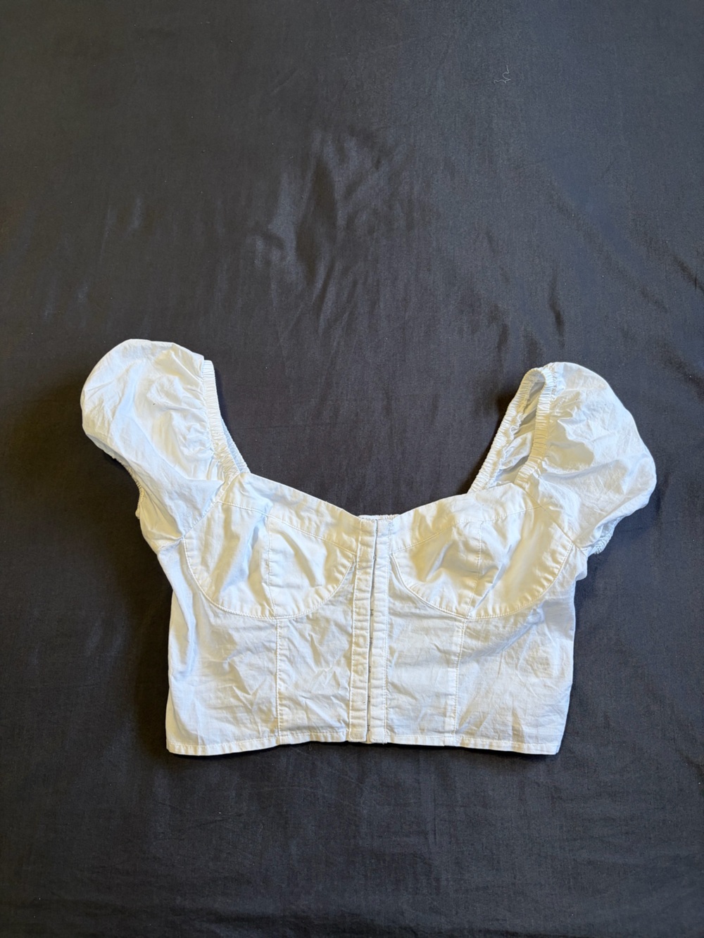 Garage White going out crop top with puffy sleeves and smocked front. Size Xs .